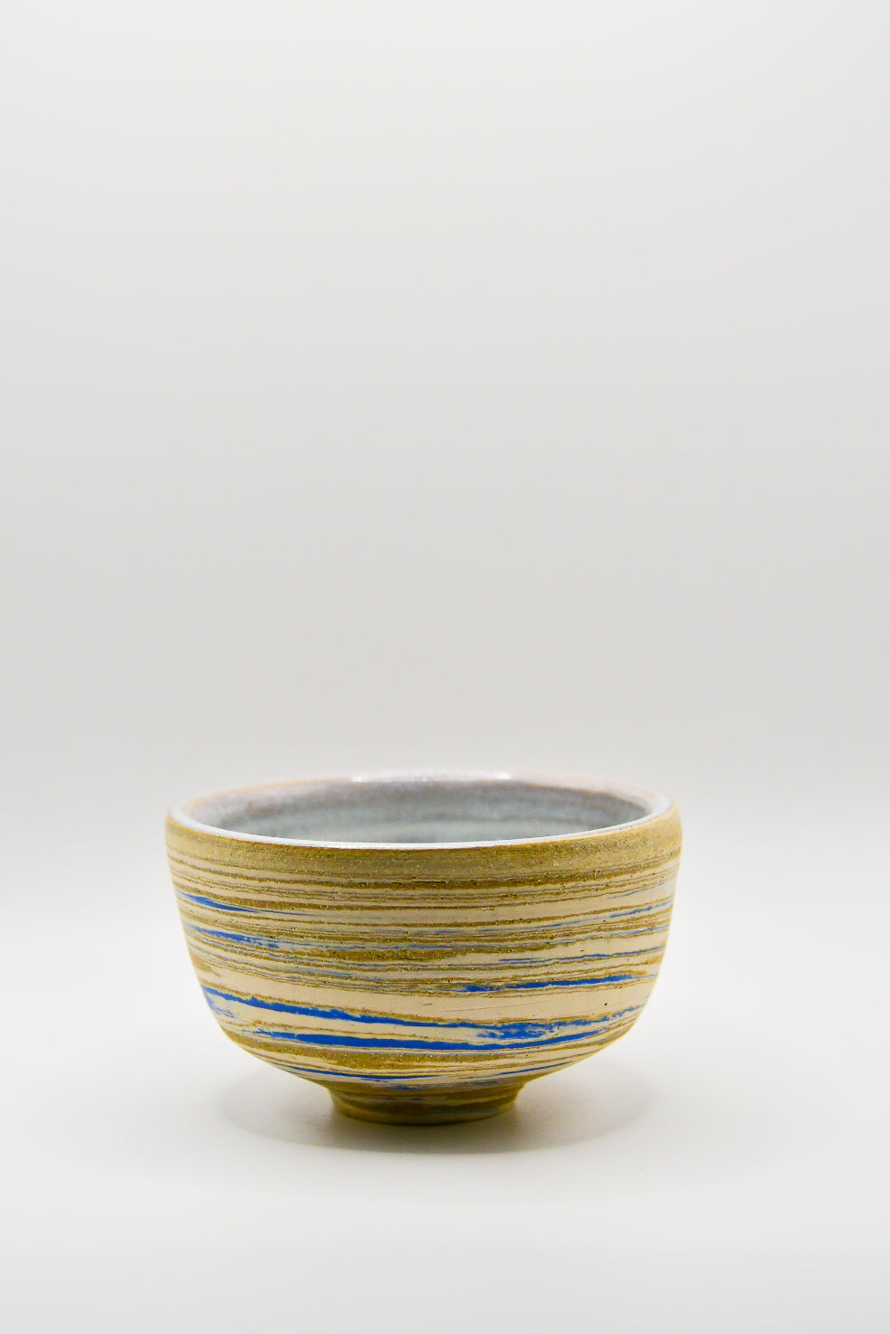 Ceramic bowl with blue accents on a white background