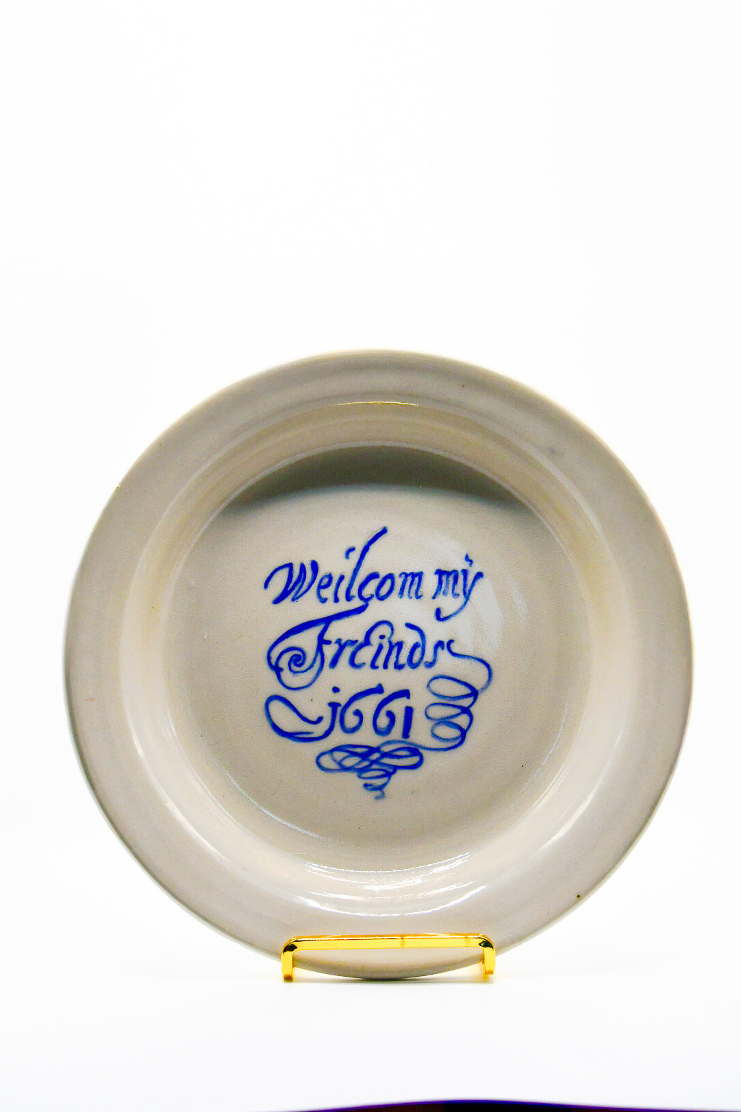 White ceramic plate with blue text on a white background