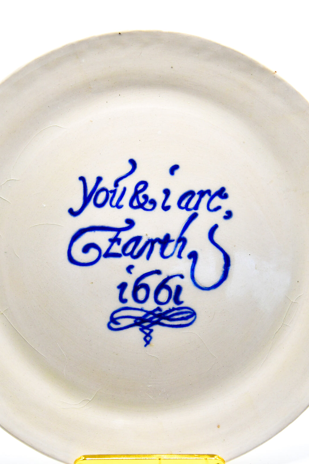 White ceramic plate with blue text on a white background