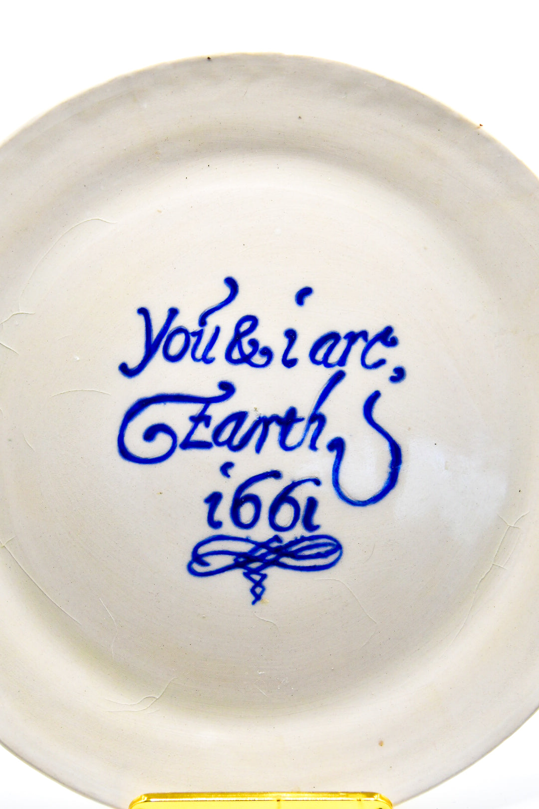White ceramic plate with blue text on a white background