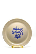White ceramic plate with blue text on a white background