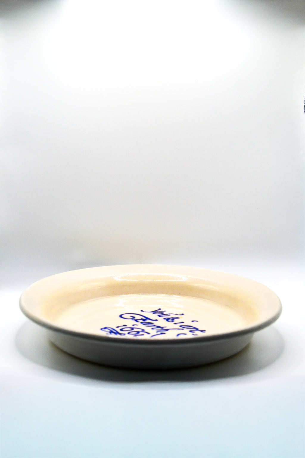 Ceramic plate with text on a white background