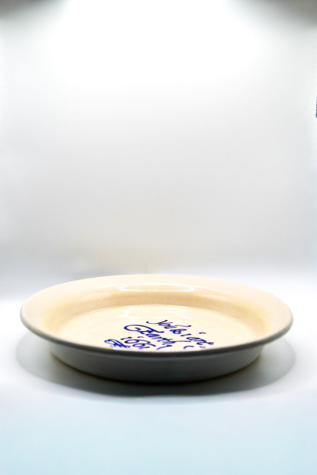 Ceramic plate with text on a white background