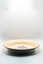 Ceramic plate with text on a white background