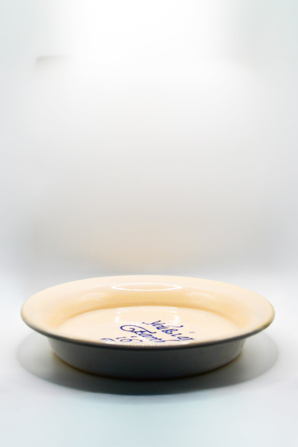 Ceramic plate with text on a white background