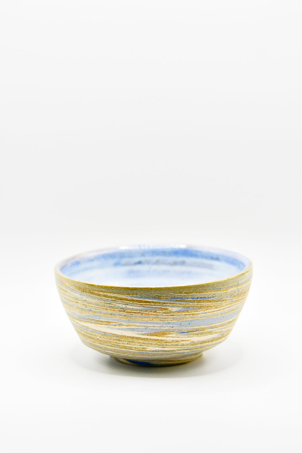 Ceramic bowl with blue and gold stripes on a white background